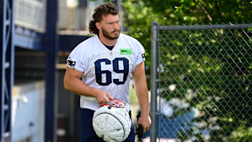Jul 26, 2023; Foxborough, MA, USA; New England Patriots guard Cole Strange (69) makes his way to the practice fields for  training camp at Gillette Stadium. Mandatory Credit: Eric Canha-Imagn Images