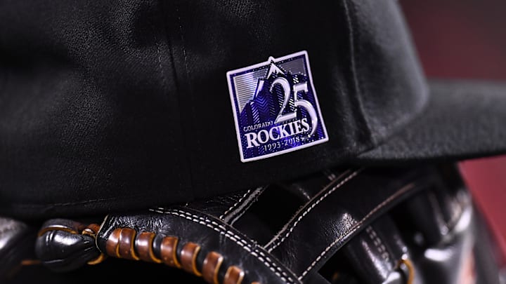 Sep 25, 2018; Denver, CO, USA; General view of Colorado Rockies center fielder Charlie Blackmon (19) (not pictured) cap and glove with the 25th anniversary logo during the game against the Philadelphia Phillies at Coors Field. 