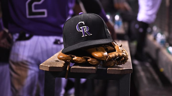Aug 4, 2017; Denver, CO, USA; General view of the hat and glove of Colorado Rockies shortstop Pat Valaika (4) (not pictured) in the seventh inning against the Philadelphia Phillies at Coors Field. 