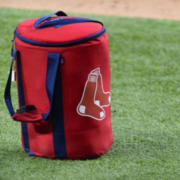 Apr 29, 2021; Arlington, Texas, USA; A view of the Boston Red Sox logo and a field bag during batting practice before the game between the Texas Rangers and the Boston Red Sox at Globe Life Field. Mandatory Credit: Jerome Miron-USA TODAY Sports