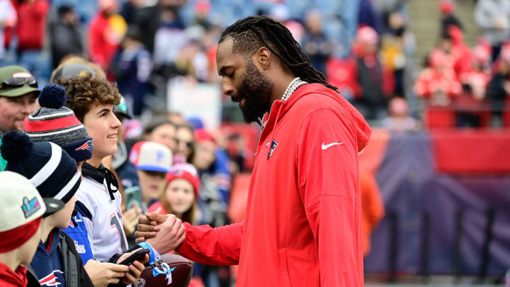 Dec 17, 2023; Foxborough, Massachusetts, USA; New England Patriots linebacker Matthew Judon (9) greets fans before a game against the Kansas City Chiefs at Gillette Stadium. Mandatory Credit: Eric Canha-USA TODAY Sports