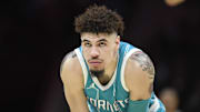 Nov 21, 2024; Charlotte, North Carolina, USA;  Charlotte Hornets guard LaMelo Ball (1) watches a foul shot during the second half against the Detroit Pistons at the Spectrum Center. Mandatory Credit: Sam Sharpe-Imagn Images