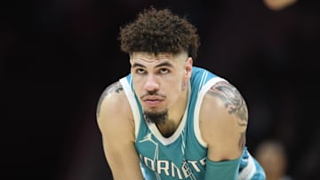 Nov 21, 2024; Charlotte, North Carolina, USA;  Charlotte Hornets guard LaMelo Ball (1) watches a foul shot during the second half against the Detroit Pistons at the Spectrum Center. Mandatory Credit: Sam Sharpe-Imagn Images