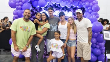 Celebrities including David and Victoria Beckhamm attend the Style Saves 14th Annual Back to School event at the Miami Beach Convention Center. 