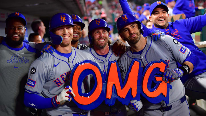 August 3, 2024; Anaheim, California, USA; New York Mets designated hitter J.D. Martinez (28) celebrates his grand slam home run against the Los Angeles Angels with left fielder Brandon Nimmo (9) and second baseman Jeff McNeil (1) during the seventh inning at Angel Stadium. Mandatory Credit: Gary A. Vasquez-USA TODAY Sports