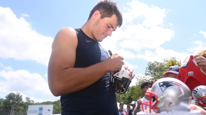 Aug 03, 2024; Foxborough, MA, USA; New England Patriots quarterback Drake Maye (10) signs an autograph at training camp at Gillette Stadium. Mandatory Credit: Eric Canha-USA TODAY Sports