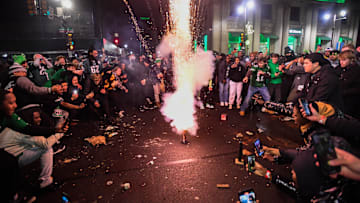 Eagles fans celebrate their Super Bowl victory with fireworks.