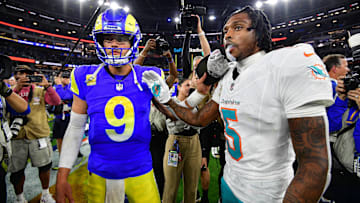 Nov 11, 2024; Inglewood, California, USA; Los Angeles Rams quarterback Matthew Stafford (9) meets with Miami Dolphins cornerback Jalen Ramsey (5) following the game at SoFi Stadium. Mandatory Credit: Gary A. Vasquez-Imagn Images