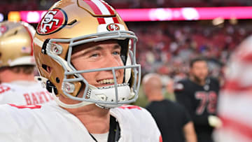 Nov 16, 2025; Glendale, Arizona, USA; San Francisco 49ers quarterback Mac Jones (10) looks on after defeating the Arizona Cardinals at State Farm Stadium. Mandatory Credit: Matt Kartozian-Imagn Images