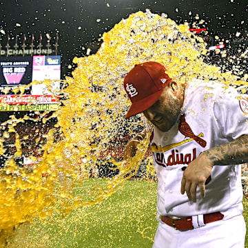 Sep 10, 2018; St. Louis, MO, USA; St. Louis Cardinals first baseman Matt Adams (15) is dunked by Francisco Pena (46) after a come from behind victory over the Pittsburgh Pirates at Busch Stadium. Mandatory Credit: Jeff Curry-Imagn Images