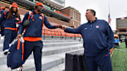 Nov 16, 2024; Champaign, Illinois, USA; Illinois Fighting Illini head coach Bret Bielema gives a hand to players before the game against the Michigan State Spartans at Memorial Stadium. Mandatory Credit: Ron Johnson-Imagn Images