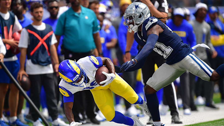 Aug 11, 2024; Inglewood, California, USA; Los Angeles Rams wide receiver Xavier Smith (19) is pushed out of bounds by Dallas Cowboys cornerback Caelen Carson (41) during the first half at SoFi Stadium. 