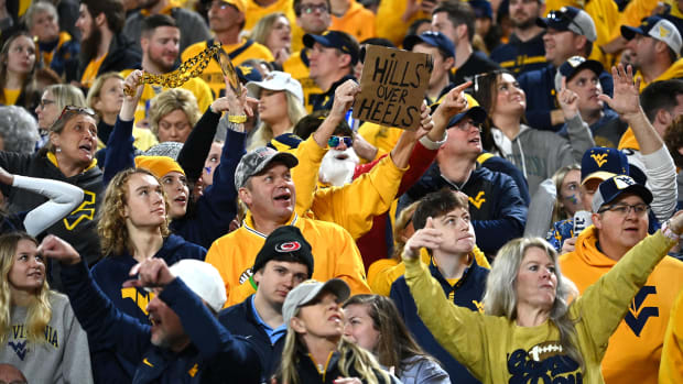West Virginia Mountaineers fans cheer in the fourth quarter at Bank of America Stadium. Credit: Bob Donnan-USA TODAY