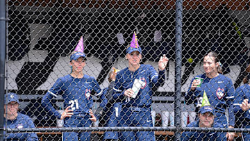 May 10, 2024; Providence, RI, USA; UConn Huskies infielder Rayah Snyder (21) and  outfielder Kaitlyn Breslin (11) watch from the dugout during the BIG EAST Softball Tournament against the Villanova Wildcats at Glay Field. Mandatory Credit: Eric Canha-Imagn Images