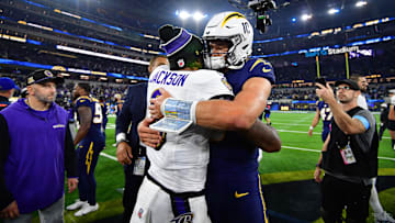 Chargers QB Justin Herbert hugs Ravens QB Lamar Jackson