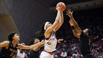 Dec 29, 2024; Bloomington, Indiana, USA;  Indiana Hoosiers forward Malik Reneau (5) rebounds the ball against Winthrop Eagles forward Tai Hamilton (21) during the first half at Simon Skjodt Assembly Hall. Mandatory Credit: Robert Goddin-Imagn Images