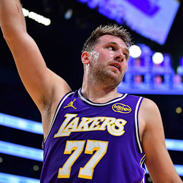 Nov 5, 2025; Los Angeles, California, USA; Los Angeles Lakers guard Luka Doncic (77) reacts after scoring the basket and drawing the foul against the San Antonio Spurs during the first half at Crypto.com Arena. Mandatory Credit: Gary A. Vasquez-Imagn Images
