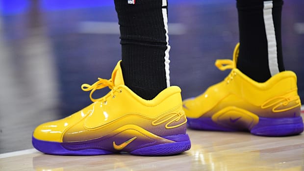 Anthony Davis's gold and purple Nike sneakers.