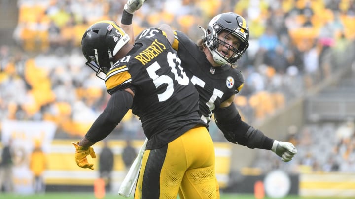 Oct 29, 2023; Pittsburgh, Pennsylvania, USA;  Pittsburgh Steelers linebackers Cole Holcomb (55) and Elandon Roberts (50) celebrate a third down tackle against the Jacksonville Jaguars during the second quarter at Acrisure Stadium. Mandatory Credit: Philip G. Pavely-USA TODAY Sports