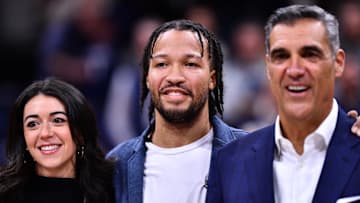 Former Villanova Wildcat player Jalen Brunson stands with former coach Jay Wright as his jersey is retired during the game against the DePaul Blue Demons at William B. Finneran Pavilion. 