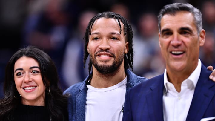 Former Villanova Wildcat player Jalen Brunson stands with former coach Jay Wright as his jersey is retired during the game against the DePaul Blue Demons at William B. Finneran Pavilion. 