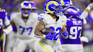 Oct 24, 2024; Inglewood, California, USA; Los Angeles Rams running back Blake Corum (22) runs the ball against the Minnesota Vikings during the first half at SoFi Stadium. Mandatory Credit: Gary A. Vasquez-Imagn Images