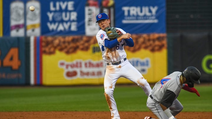 Tennessee Smokies' infielder James Triantos (6) throws the ball to first base after getting an out at second base during the last opening day game at the Tennessee Smokies Stadium on Friday, April 5, 2024 in Kodak, Tenn.