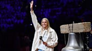 WNBA star Elena Delle Donne waves to the crowd before ringing the bell before game between Philadelphia 76ers and Miami Heat.