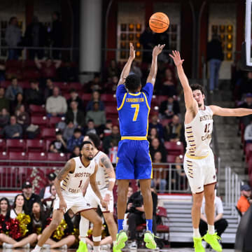 Mar 2, 2024; Chestnut Hill, Massachusetts, USA; Pittsburgh Panthers guard Carlton Carrington (7) shoots the ball over Boston College Eagles forward Quinten Post (12) during the second half at Conte Forum. Mandatory Credit: Eric Canha-USA TODAY Sports