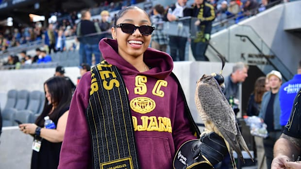 USC Trojans womens basketball guard JuJu Watkins smiles with the LAFC falcon before the game against the New York Red Bulls