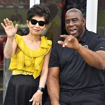 Sep 7, 2024; Washington, District of Columbia, USA; Washington Spirit owner Michele Kang and Washington Commanders owner Magic Johnson before the game against Portland Thorns FC at Audi Field. Mandatory Credit: Brad Mills-Imagn Images