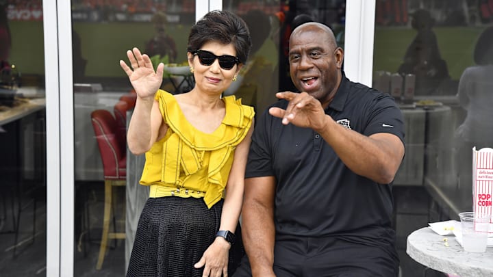 Sep 7, 2024; Washington, District of Columbia, USA; Washington Spirit owner Michele Kang and Washington Commanders owner Magic Johnson before the game against Portland Thorns FC at Audi Field. Mandatory Credit: Brad Mills-Imagn Images