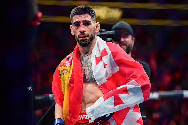 Ilia Topuria celebrates his championship victory against Alexander Volkanovski during UFC 298 at Honda Center. 