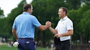 Scottie Scheffler and Jordan Spieth shake hands on the ninth green following their second round of the THE CJ CUP Byron Nelson golf tournament. 