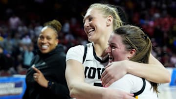 Iowa's Sydney Affolter (3) and Taylor Stremlow (1) celebrates following the first round of the NCAA Women's college basketball game between Iowa and Murray State at the Lloyd Noble Center in Norman, Okla., Saturday, March, 22, 2025.