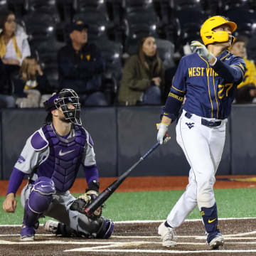 West Virginia junior JJ Wetherholt watches his solo home run in the bottom of the sixth inning. 