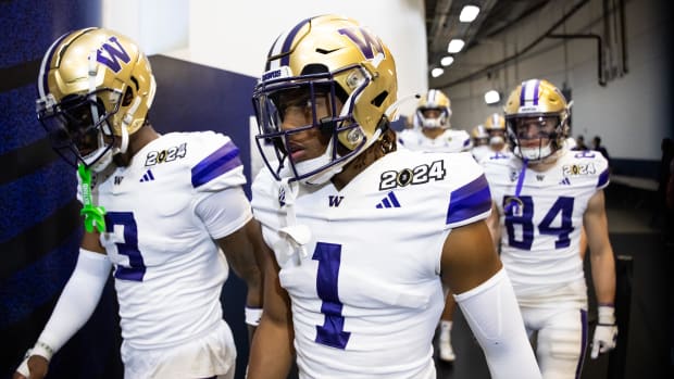 Washington Huskies cornerback Jabbar Muhammad (1) and Mishael Powell (3) against the Michigan Wolverines during 