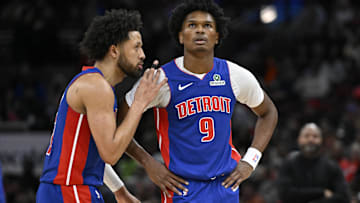 Detroit Pistons guard Cade Cunningham (2) and forward Ausar Thompson (9) chat against the Chicago Bulls during the second half at the United Center.