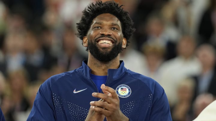 Aug 10, 2024; Paris, France; United States centre Joel Embiid celebrates with the gold medal after the game against France.