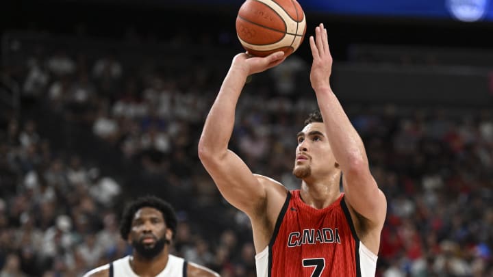 Jul 10, 2024; Las Vegas, Nevada, USA; Canada forward Dwight Powell (7) shoots a free throw against USA in the third quarter in the USA Basketball Showcase at T-Mobile Arena. Mandatory Credit: Candice Ward-USA TODAY Sports