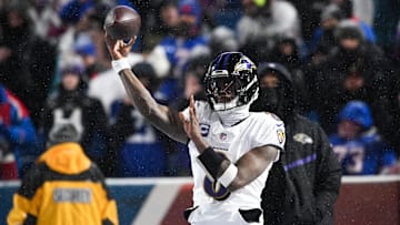 Jan 19, 2025; Orchard Park, New York, USA; Baltimore Ravens quarterback Lamar Jackson (8) throws the ball during warm ups before the game against the Buffalo Bills in a 2025 AFC divisional round game at Highmark Stadium. Mandatory Credit: Mark Konezny-Imagn Images