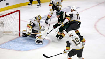 Apr 26, 2025; Saint Paul, Minnesota, USA; Minnesota Wild center Joel Eriksson Ek (14) crashes the net during 1st OT in game four of the first round of the 2025 Stanley Cup Playoffs at Xcel Energy Center. Mandatory Credit: Bruce Fedyck-Imagn Images