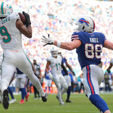 Miami Dolphins safety Ifeatu Melifonwu (9) makes an interception against Buffalo Bills tight end Dawson Knox (88) during the second half at Hard Rock Stadium.