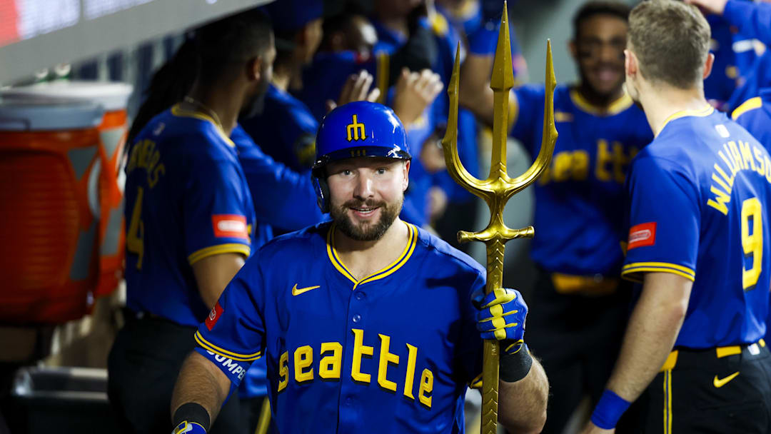 May 30, 2025; Seattle, Washington, USA; Seattle Mariners catcher Cal Raleigh (29) celebrates in the dugout after hitting a two-run home run against the Minnesota Twins during the eighth inning at T-Mobile Park. Mandatory Credit: Joe Nicholson-Imagn Images