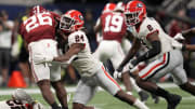 Dec 2, 2023; Atlanta, GA, USA; Georgia Bulldogs defensive back Malaki Starks (24) makes a tackle on Alabama Crimson Tide running back Jam Miller (26) during the second half in the SEC Championship game at Mercedes-Benz Stadium. Mandatory Credit: Dale Zanine-USA TODAY Sports