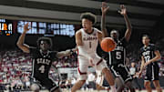 Feb 25, 2025; Tuscaloosa, AL, USA;  Alabama guard Mark Sears (1) drives into the lane and passes as he is defended by Mississippi State forward Cameron Matthews (4) and Mississippi State guard Shawn Jones Jr. (5) at Coleman Coliseum. Alabama defeated Mississippi State 111-73. 