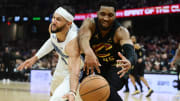 May 5, 2024; Cleveland, Ohio, USA; Cleveland Cavaliers guard Donovan Mitchell (45) goes for a loose ball against Orlando Magic guard Jalen Suggs (4) during the first half in game seven of the first round for the 2024 NBA playoffs at Rocket Mortgage FieldHouse. 