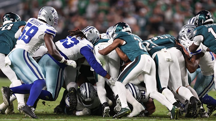 The Philadelphia Eagles execute a tush push for a first down against the Dallas Cowboys during the fourth quarter of the NFL game