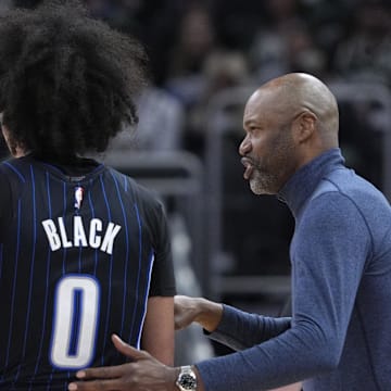 Orlando Magic head coach Jamahl Mosely gives instructions to guard Anthony Black (0) in the first half against the Milwaukee Bucks at Fiserv Forum.