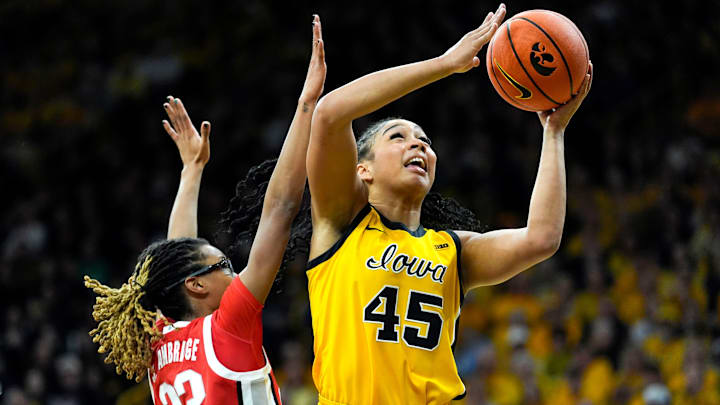Iowa forward Hannah Stuelke (45) shoots the basketball against Ohio State guard Jaloni Cambridge (22) Jan. 25, 2026 at Carver-Hawkeye Arena in Iowa City, Iowa.